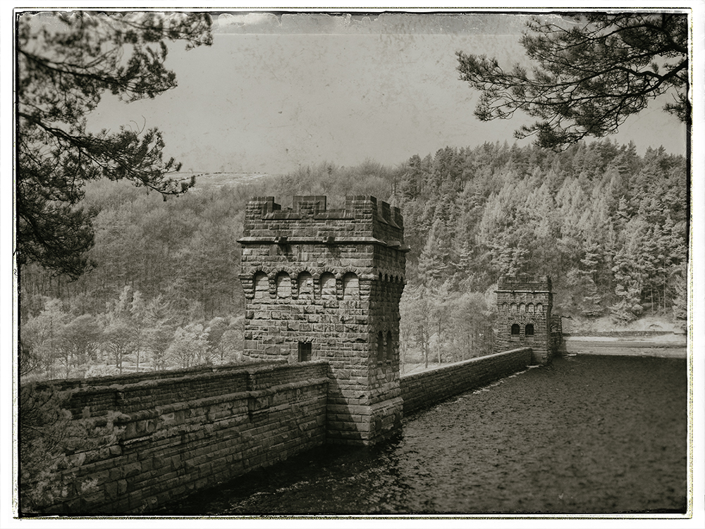 The dam at Ladybower. Captured on a Panasonic GX1 converted to shoot infrared then processed in Nik Silver Efex Pro and Nik Analog Efex.