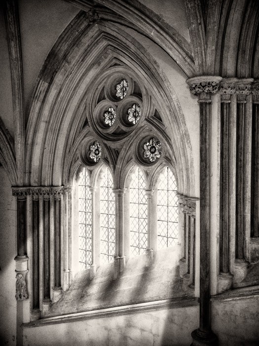 Wells Cathedral, Olympus EM5, ISO800, f/5.6, 1/20". Processed in Photoshop with Nik Silver Efex Pro. The window light is totally false.