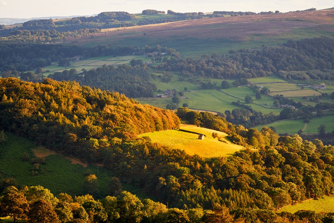 Peak District hills at sunset.